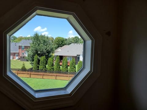 A masterful replacement of a octagonal accent window